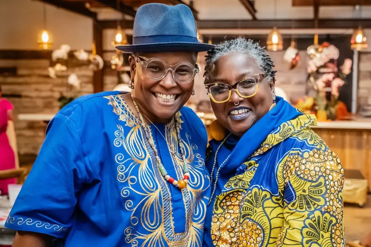 Two well dressed women smiling