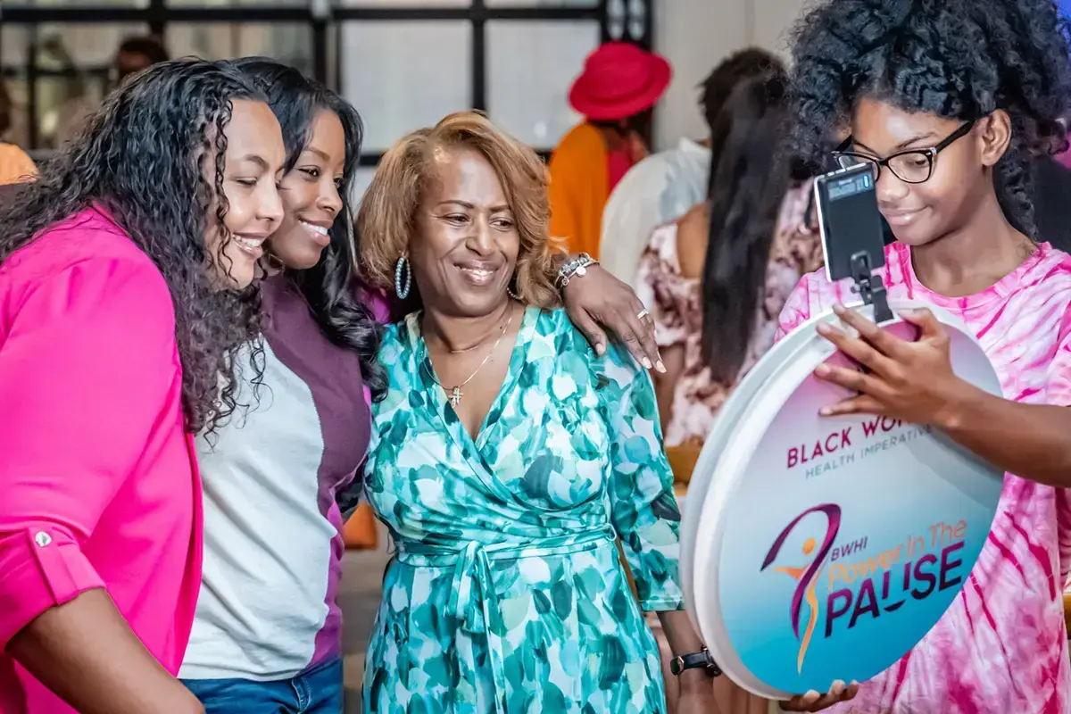 3 woman taking a selfie with Power In Pause digital photo booth